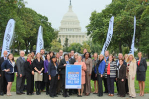 Photo of United Way staff members in front of Capitol Hill, holding sign that reads 'United Way Advocacy Forum & Hill Day"