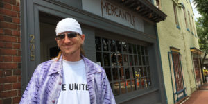 Photo of man in LIve United tee shirt outside Mercantile restaurant